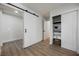 Bright bedroom features a sliding barn door and a closet with shelving at 1917 N Moapa Valley Blvd, Logandale, NV 89021