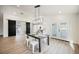 Dining room boasts modern chandelier, direct entry to kitchen and access to outdoor patio at 1917 N Moapa Valley Blvd, Logandale, NV 89021