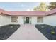 Charming single-story home with a red tile roof, black trim windows, and manicured landscaping at 1917 N Moapa Valley Blvd, Logandale, NV 89021