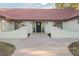 Home's front entrance with tile roof and manicured landscaping at 1917 N Moapa Valley Blvd, Logandale, NV 89021