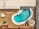 Aerial view of a kidney-shaped pool and outdoor seating in a landscaped backyard at 2021 N Michael Way, Las Vegas, NV 89108