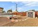 Private backyard with a pool, shed, and lounge chairs at 2021 N Michael Way, Las Vegas, NV 89108