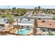 Aerial view showcasing home with a kidney-shaped pool, covered patio, and gravel landscaping at 2021 N Michael Way, Las Vegas, NV 89108