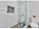 Modern bathroom featuring a glass shower with marble tiling and sleek fixtures at 2021 N Michael Way, Las Vegas, NV 89108
