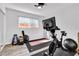 Well-equipped home gym with a stationary bike and free weights, ideal for fitness enthusiasts at 2021 N Michael Way, Las Vegas, NV 89108