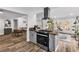 Stylish kitchen with stainless steel oven and open layout to the dining and living areas at 2021 N Michael Way, Las Vegas, NV 89108