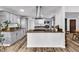 Modern kitchen island with stainless steel appliances and gray cabinetry at 2021 N Michael Way, Las Vegas, NV 89108
