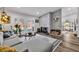 Inviting living room showcasing a brick fireplace, comfortable seating, and access to outdoor space at 2021 N Michael Way, Las Vegas, NV 89108