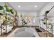 Bright and airy living space with a glass door and unique décor with greenery at 2021 N Michael Way, Las Vegas, NV 89108