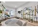 Bright space featuring a workstation with a glass door view and stylish interior with greenery at 2021 N Michael Way, Las Vegas, NV 89108