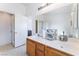 Double sink bathroom features a door to the shower at 2117 Mountain Sunset Ave, North Las Vegas, NV 89031