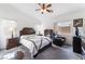 Well-lit bedroom complete with furnishings, including a leather recliner at 2117 Mountain Sunset Ave, North Las Vegas, NV 89031
