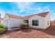 Charming single-story home with a red tile roof, low maintenance landscaping, and an attached two-car garage at 2117 Mountain Sunset Ave, North Las Vegas, NV 89031