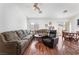 Open living room features beautiful laminate flooring and a neutral color palette at 2117 Mountain Sunset Ave, North Las Vegas, NV 89031