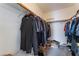 Spacious walk-in closet filled with hanging clothes, offering ample storage at 2117 Mountain Sunset Ave, North Las Vegas, NV 89031