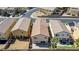 Aerial view of a home displaying the backyard layout, neighboring properties, and mature trees at 236 Dog Leg Dr, Las Vegas, NV 89148