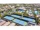 Overhead view of tennis courts, pool, and community center surrounded by green landscaping at 236 Dog Leg Dr, Las Vegas, NV 89148