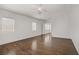 Spacious bedroom with hardwood floors, natural light, and a ceiling fan at 236 Dog Leg Dr, Las Vegas, NV 89148
