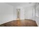 Cozy bedroom with wood laminate flooring, closet, and neutral paint at 236 Dog Leg Dr, Las Vegas, NV 89148
