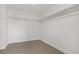 Walk-in closet features white walls, tiled floors, and rack to hang clothing at 236 Dog Leg Dr, Las Vegas, NV 89148