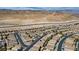 Wide aerial of community near mountains and highway, showcasing community layout and surrounding landscape at 236 Dog Leg Dr, Las Vegas, NV 89148