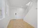 Bright entryway with tile flooring, white walls, staircase, and a window for natural light at 236 Dog Leg Dr, Las Vegas, NV 89148