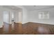 Spacious living room with laminate floors, baseboards, and natural light at 236 Dog Leg Dr, Las Vegas, NV 89148