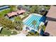 Overhead shot of the community's swimming pool and playground surrounded by palm trees at 236 Dog Leg Dr, Las Vegas, NV 89148