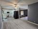 View of the kitchen with white cabinets, appliances, and light-colored vinyl flooring at 2501 Capistrano Ave, Las Vegas, NV 89121