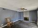 Living room featuring a brick fireplace, ceiling fan, and natural light at 2501 Capistrano Ave, Las Vegas, NV 89121