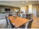 Dining area with wooden table, open floor plan connecting to kitchen and living spaces at 2674 Duneville St, Las Vegas, NV 89146