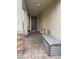 Inviting covered front porch with stylish pavers and seating area, perfect for relaxing outdoors at 2674 Duneville St, Las Vegas, NV 89146