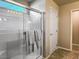 Bright bathroom with a modern glass-enclosed shower featuring sleek fixtures and tile at 2674 Duneville St, Las Vegas, NV 89146