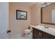 Bathroom featuring a white toilet, and a vanity with a mirror at 2721 Family Ct, Las Vegas, NV 89117