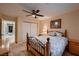 Bedroom featuring light yellow walls, a ceiling fan, and an open closet at 2721 Family Ct, Las Vegas, NV 89117