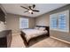 This bedroom offers neutral walls, carpet, a fan and shuttered windows at 2721 Family Ct, Las Vegas, NV 89117