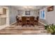 Formal dining room boasts wood floors, decorative chandelier and seating for eight at 2721 Family Ct, Las Vegas, NV 89117