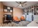 Office space featuring bookshelves, two orange chairs, and carpet at 2721 Family Ct, Las Vegas, NV 89117
