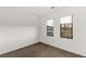 Bedroom featuring two windows and carpeted floors at 350 Solitude Peak Ln, Henderson, NV 89012