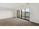 Bright bedroom with a large sliding glass door to a balcony and offering views at 350 Solitude Peak Ln, Henderson, NV 89012