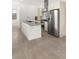 Modern kitchen features an island, stainless steel appliances, and sleek cabinets, offering a stylish space at 350 Solitude Peak Ln, Henderson, NV 89012
