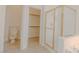 Bathroom featuring glass-enclosed shower, toilet, and linen closet for convenient storage at 3658 Auckland Castle St, Las Vegas, NV 89135