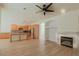 Open floorplan kitchen, dining, and living area with fireplace and neutral color scheme at 3658 Auckland Castle St, Las Vegas, NV 89135