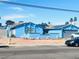 Charming single-story home featuring a blue exterior, desert landscaping, and solar panels at 3664 Rawhide St, Las Vegas, NV 89120