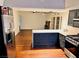 Open kitchen flows seamlessly into the living area, featuring stainless steel appliances and hardwood floors at 3664 Rawhide St, Las Vegas, NV 89120