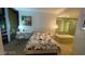 Cozy bedroom features a desk, a comfortable bed with floral linens, and an ensuite bathroom with a soaking tub at 3722 Las Vegas Blvd # 1205, Las Vegas, NV 89158
