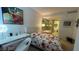 Bedroom features a desk, a comfortable bed with floral linens, and an ensuite bathroom with a soaking tub at 3722 Las Vegas Blvd # 1205, Las Vegas, NV 89158
