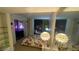 Bedroom featuring city views, modern lighting, and neutral carpeting and shelving at 3722 Las Vegas Blvd # 1205, Las Vegas, NV 89158