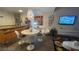 A modern dining area boasts an artistic chandelier, chic decor, and a kitchen island, perfect for entertaining at 3722 Las Vegas Blvd # 1205, Las Vegas, NV 89158