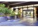 Contemporary building entrance with glass doors and modern landscaping offering a welcoming and stylish arrival at 3722 Las Vegas Blvd # 1205, Las Vegas, NV 89158